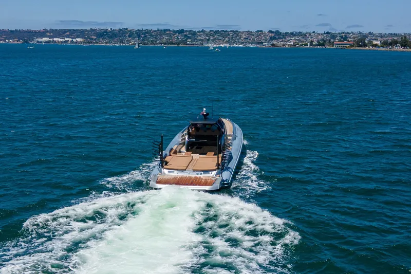 Slide: The Image of 2014 SACS Strider yacht cruising on blue ocean near coastal cityscape. - 10