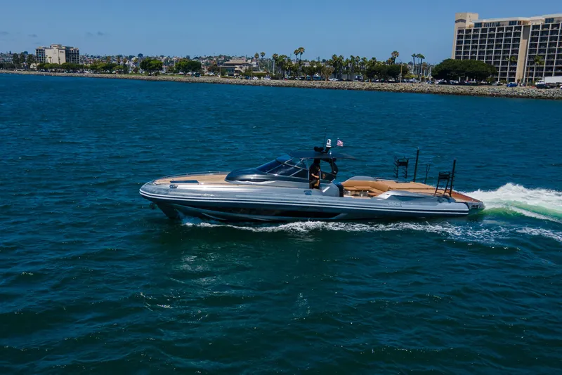 Slide: The Image of 2014 SACS Strider yacht cruising on blue ocean near coastal cityscape. - 11