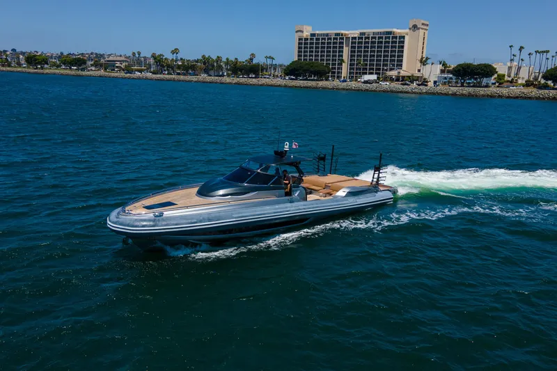 Slide: The Image of 2014 SACS Strider yacht cruising on open water, showcasing sleek design and luxury features. - 12