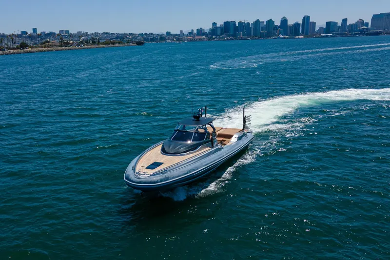 Slide: The Image of Luxury 2014 SACS Strider yacht cruising in blue ocean near city skyline. - 2