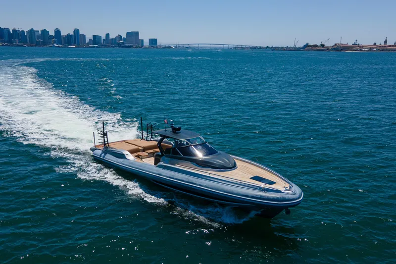 Slide: The Image of 2014 SACS Strider yacht cruising near city skyline and bridge. - 6