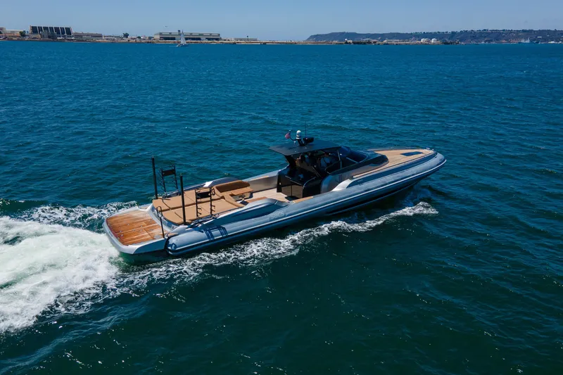 Slide: The Image of 2014 SACS Strider yacht cruising on open blue water. - 9