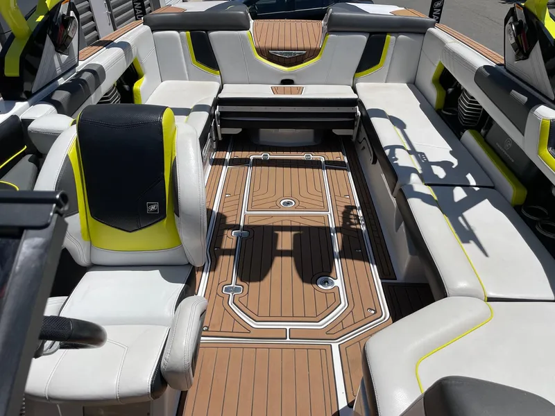 Slide: The Image of 2017 Nautique Super Air Nautique G25 interior with stylish seating and teak flooring. - 12