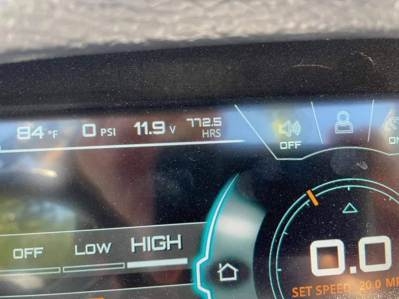 Slide: The Image of Dashboard display of a 2017 Nautique Super Air Nautique G25 showing temperature, voltage, and hours. - 13