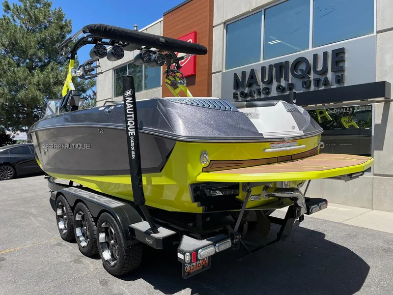 Slide: The Image of 2017 Nautique Super Air Nautique G25 boat on trailer outside dealership. - 3