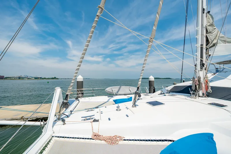 Slide: The Image of Luxury Privilege 745 yacht docked, 2008 model, with clear blue sky and calm waters. - 32