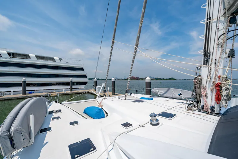 Slide: The Image of Sailing yacht Privilege 745, 2008 model, docked near a large cruise ship on a sunny day. - 34