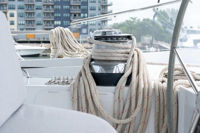 Slide: The Image of Sailing yacht deck with coiled ropes, Privilege 745, 2008 model, marina background. - 35