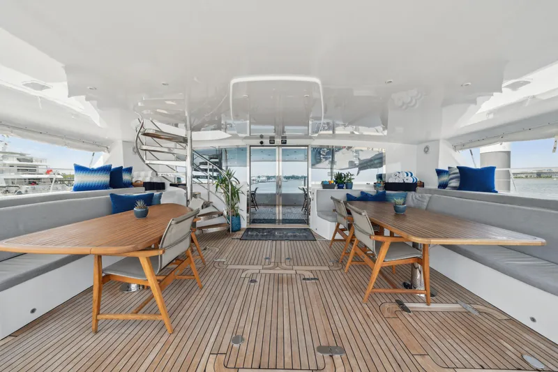 Slide: The Image of Luxurious 2008 Privilege 745 yacht interior with elegant seating and wooden tables. - 45