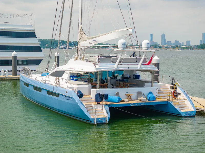 Slide: The Image of Luxury Privilege 745 yacht docked in marina, city skyline in background, 2008 model. - 8