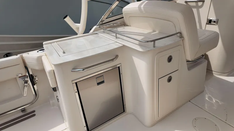Slide: The Image of 2026 Grady-White Freedom 285 boat interior with seating and storage compartments. - 10