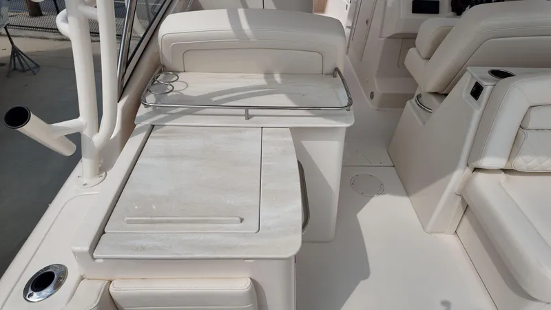 Slide: The Image of 2026 Grady-White Freedom 285 boat interior with seating and storage features. - 13