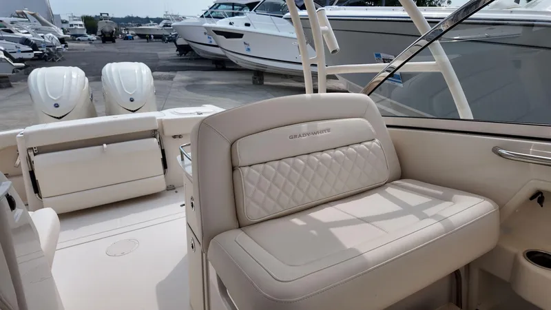 Slide: The Image of 2026 Grady-White Freedom 285 boat interior with luxurious seating and dual engines. - 18