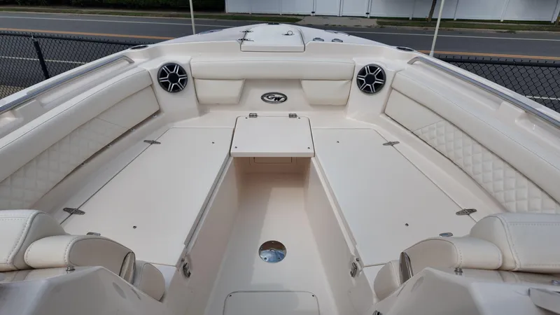 Slide: The Image of 2026 Grady-White Freedom 285 boat interior with spacious seating and modern design. - 21