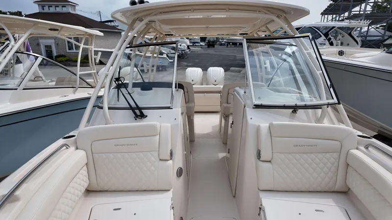Slide: The Image of 2026 Grady-White Freedom 285 boat interior with luxurious seating and open deck. - 24