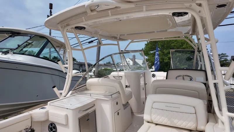 Slide: The Image of 2026 Grady-White Freedom 285 boat interior with seating and helm station. - 4