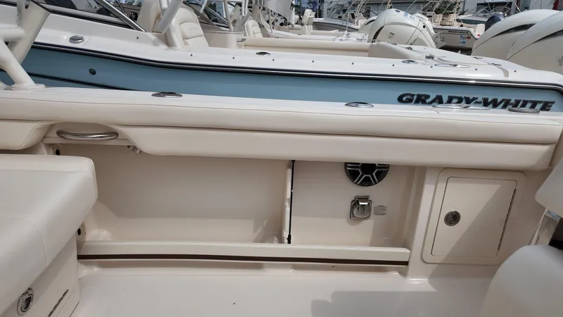 Slide: The Image of 2026 Grady-White Freedom 285 boat interior with seating and storage compartments. - 8