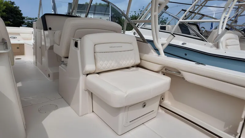 Slide: The Image of 2026 Grady-White Freedom 285 boat interior with luxurious seating and modern design. - 9