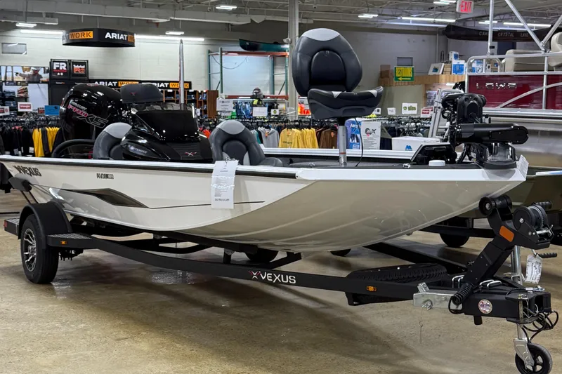 Slide: The Image of 2026 Vexus AVX189 boat on display in a showroom, featuring sleek design and modern equipment. - 1