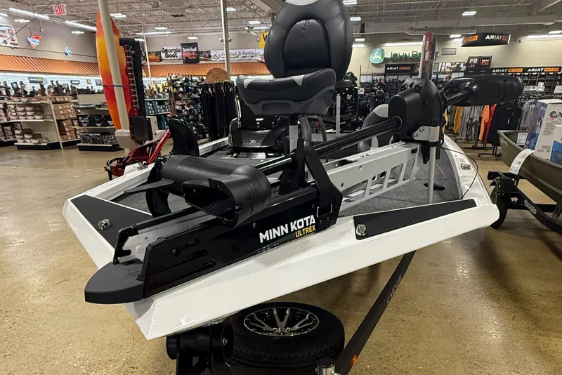 Slide: The Image of 2026 Vexus AVX189 boat with Minn Kota Ultrex motor displayed in a store. - 2