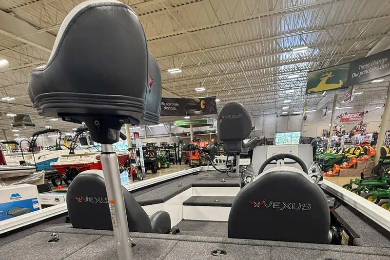 Slide: The Image of 2026 Vexus AVX189 boat interior with seating, displayed in a showroom. - 4