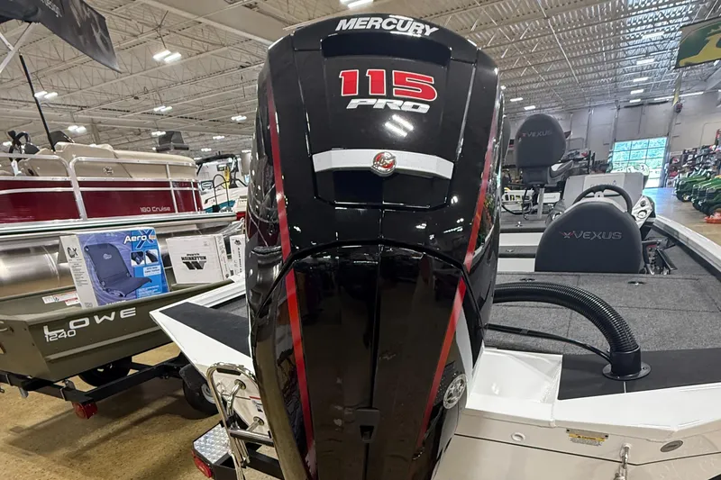 Slide: The Image of 2026 Vexus AVX189 boat with Mercury 115 Pro outboard motor in showroom. - 5