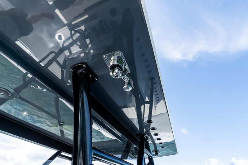 Slide: The Image of 2026 Invincible 33 Catamaran T-top detail against blue sky. - 33