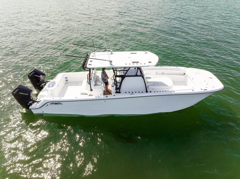 Slide: The Image of 2026 Invincible 33 Catamaran on water, featuring dual Mercury engines, sleek design. - 38