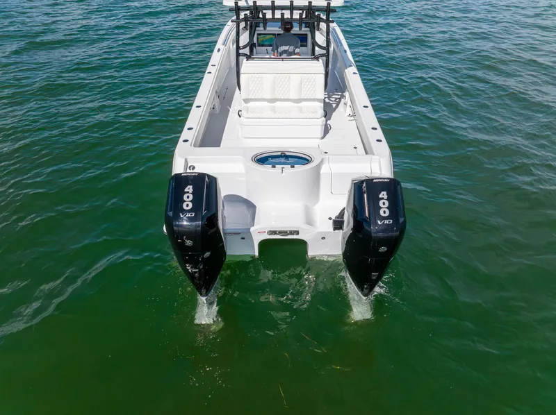 Slide: The Image of 2026 Invincible 33 Catamaran with dual Mercury 400 V10 engines on open water. - 41