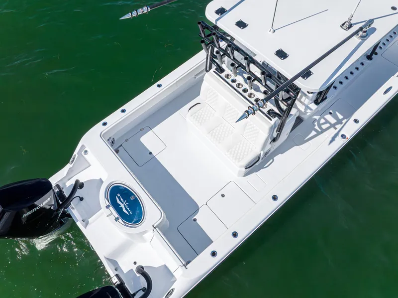 Slide: The Image of 2026 Invincible 33 Catamaran, aerial view, spacious deck, dual engines, sleek design. - 42