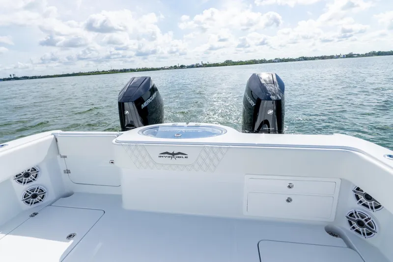 Slide: The Image of 2026 Invincible 33 Catamaran with dual Mercury engines on open water. - 5