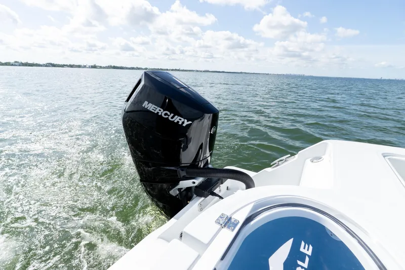 Slide: The Image of 2026 Invincible 33 Catamaran with Mercury engine cruising on open water. - 7