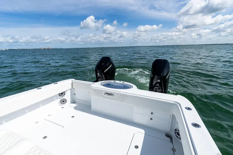 Slide: The Image of 2026 Invincible 33 Catamaran on open water, featuring dual Mercury engines. - 8