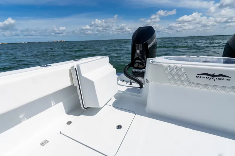 Slide: The Image of 2026 Invincible 33 Catamaran on water, featuring sleek design and powerful engine. - 9