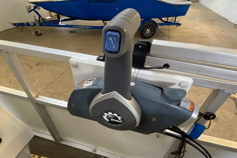 Slide: The Image of Boat throttle control on a 2007 Palm Beach 220 LX, with a blue trailer in the background. - 8