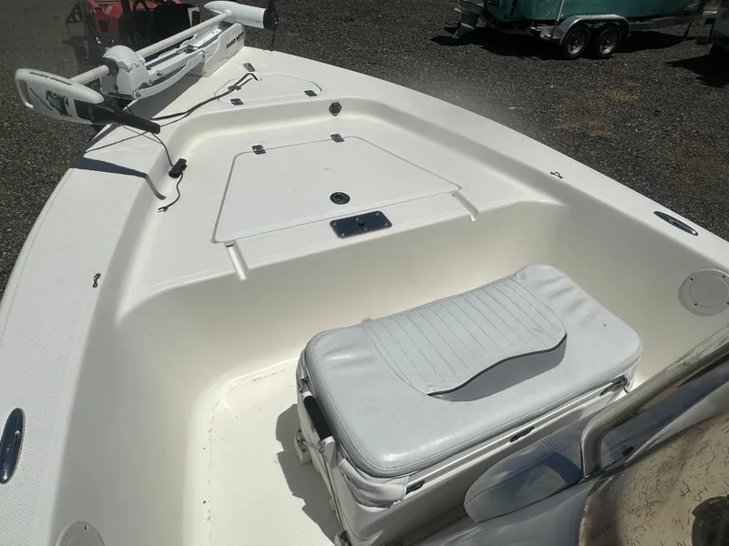 Slide: The Image of 2009 Key West 176 Bay Reef boat interior with seating and storage compartments. - 15