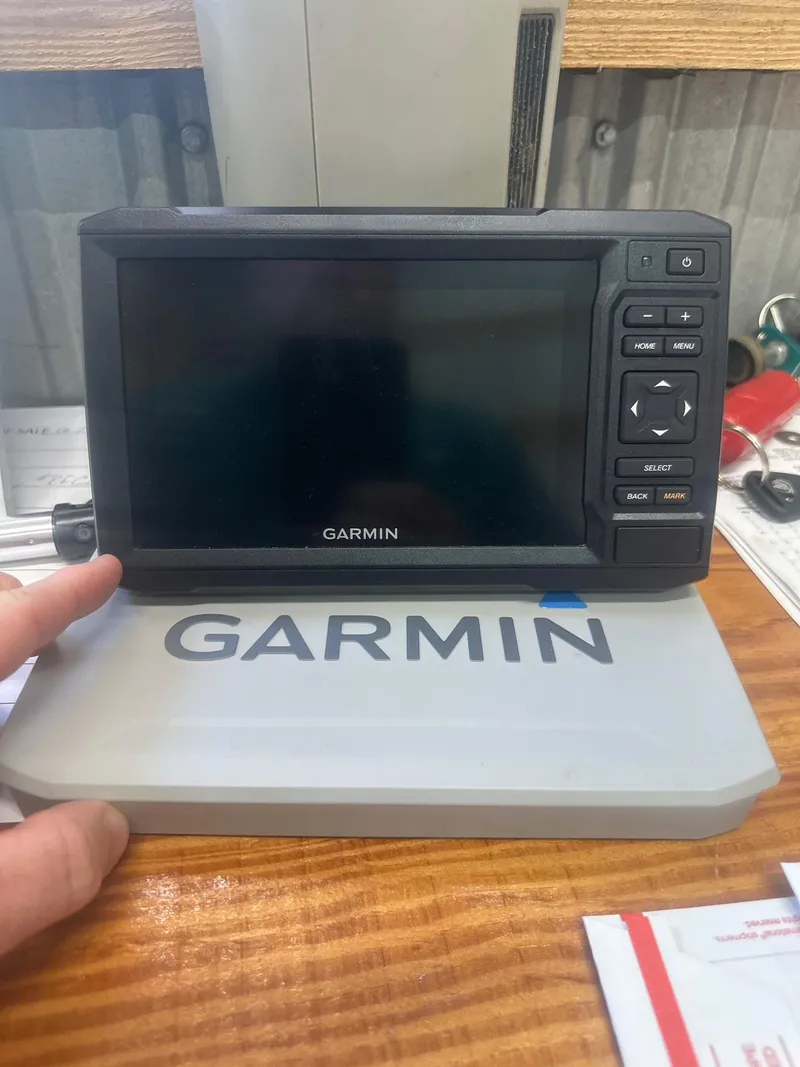 Slide: The Image of Garmin marine GPS device on wooden surface, Key West 176 Bay Reef 2009 model. - 17