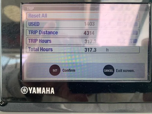 Slide: The Image of Yamaha display showing trip data: 4314 distance, 317.3 hours, on a 2014 Robalo R247 Dual Console. - 8