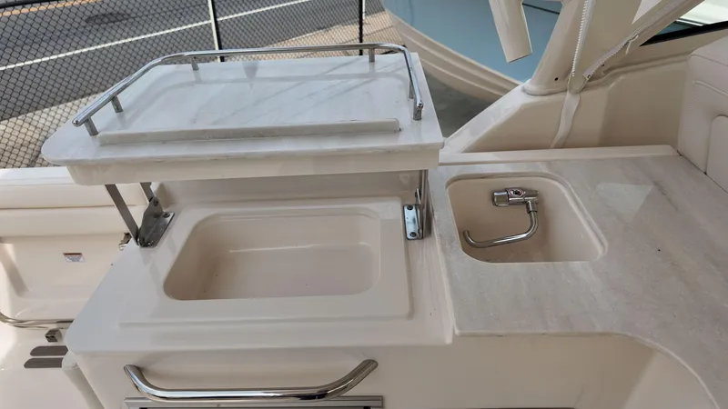 Slide: The Image of 2026 Grady-White Freedom 325 boat interior with sink and countertop. - 10