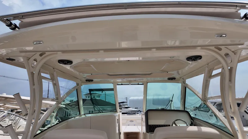 Slide: The Image of 2026 Grady-White Freedom 325 boat interior with helm and seating area. - 11