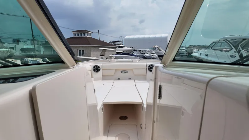 Slide: The Image of 2026 Grady-White Freedom 325 boat interior with open deck and seating area. - 17