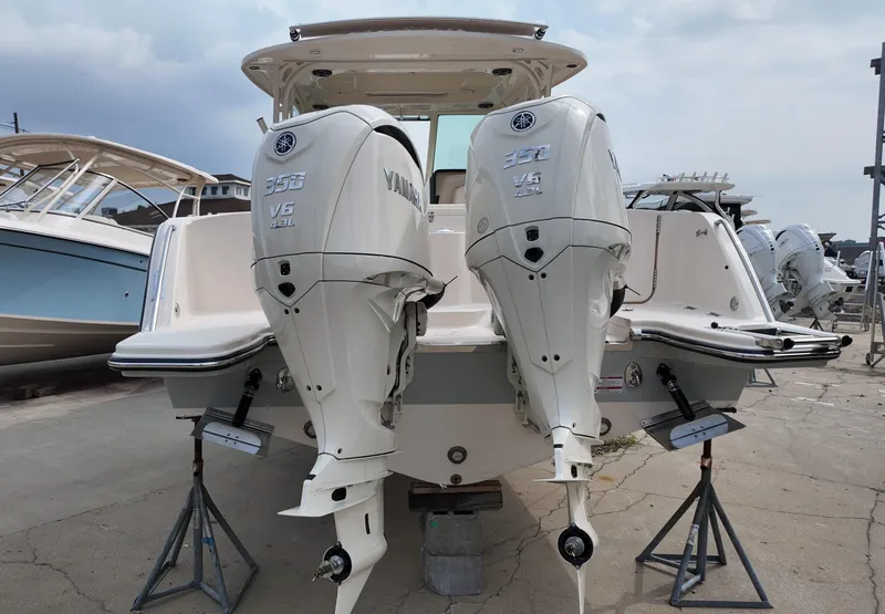 Slide: The Image of 2026 Grady-White Freedom 325 boat with twin Yamaha 350 V6 outboard engines. - 2