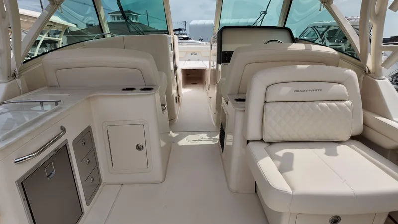 Slide: The Image of 2026 Grady-White Freedom 325 boat interior with luxurious seating and modern amenities. - 7