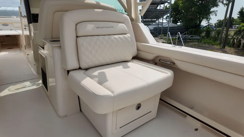 Slide: The Image of 2026 Grady-White Freedom 325 boat interior with luxurious seating and storage. - 8