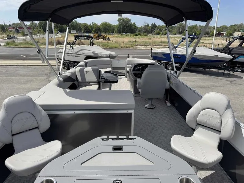 Slide: The Image of 2025 Trifecta 22TRFC LE pontoon boat with spacious seating and modern design. - 2