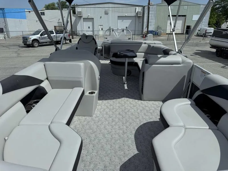 Slide: The Image of 2025 Trifecta 22TRFC LE pontoon boat interior with gray seating and carpet. - 6