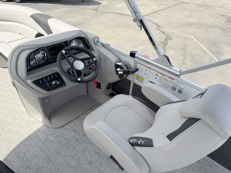 Slide: The Image of 2025 Trifecta 22TRFC LE boat interior with steering wheel and control panel. - 8