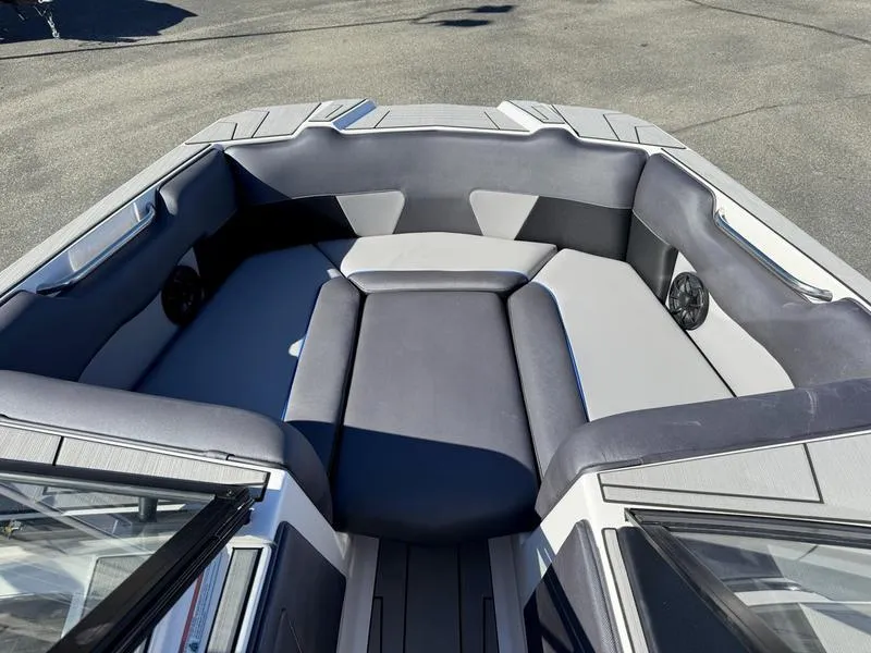 Slide: The Image of 2020 Moomba Max boat interior with gray seating and speakers. - 10