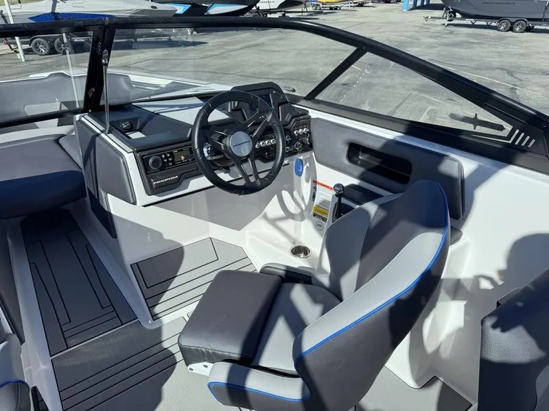 Slide: The Image of 2020 Moomba Max boat interior with steering wheel and dashboard controls. - 11