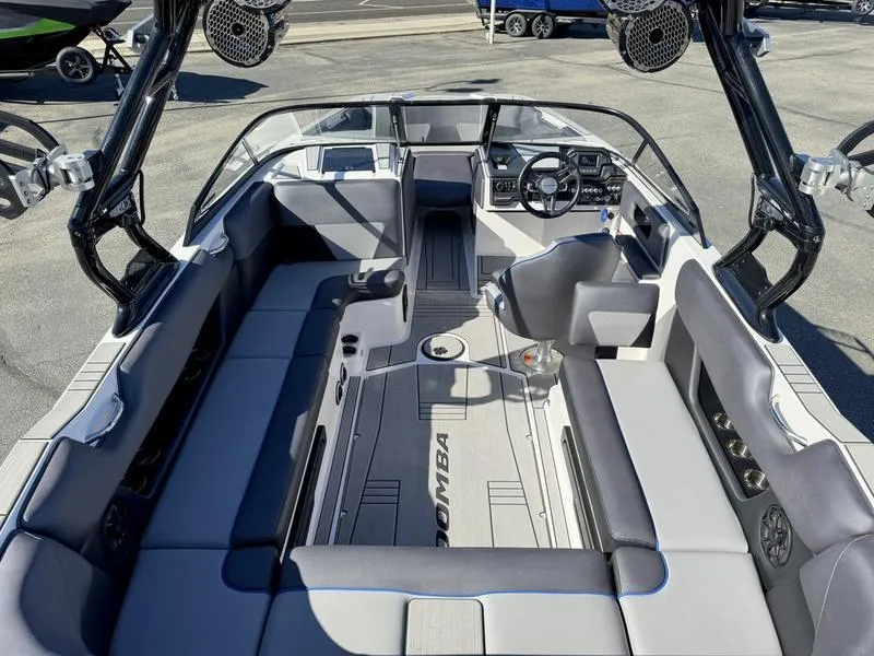 Slide: The Image of 2020 Moomba Max boat interior with spacious seating and modern dashboard. - 8